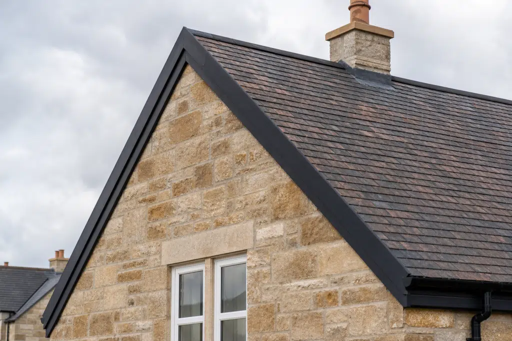 Pitched tiled roof with a dry verge system fitted along the gable edge