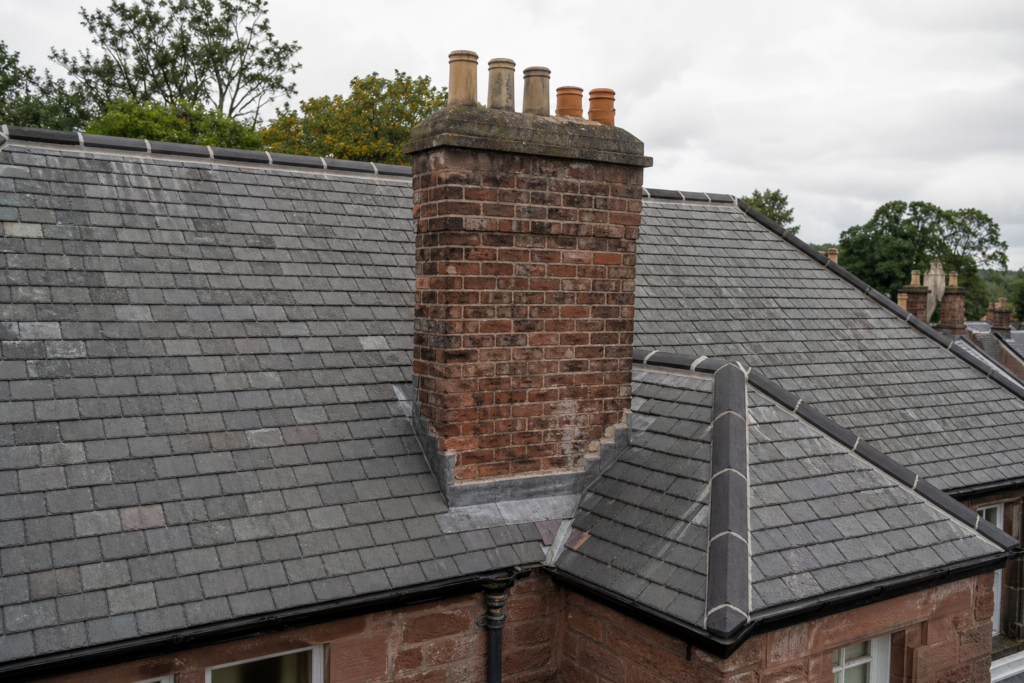 Lead flashing around a chimney on a traditional Scottish slate roof